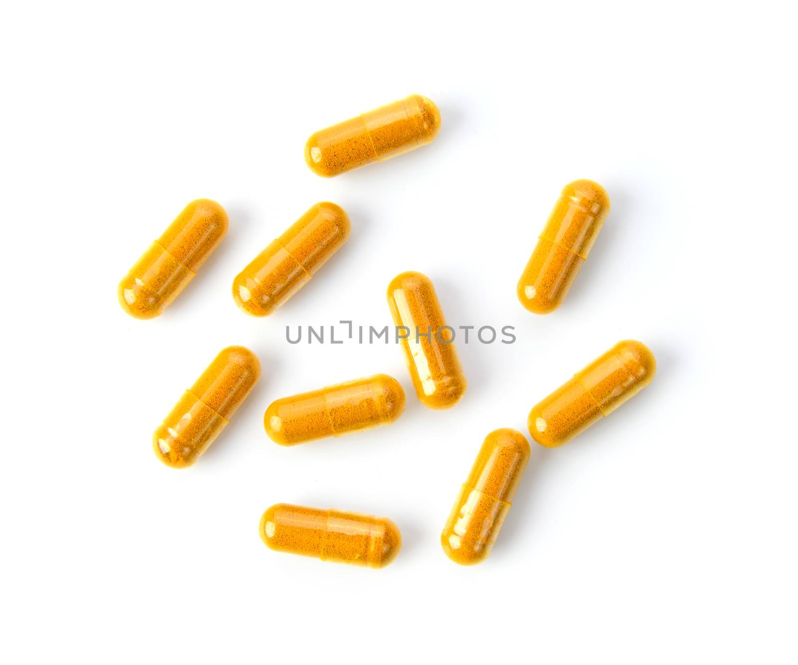 Turmeric Capsule on white background by sommai