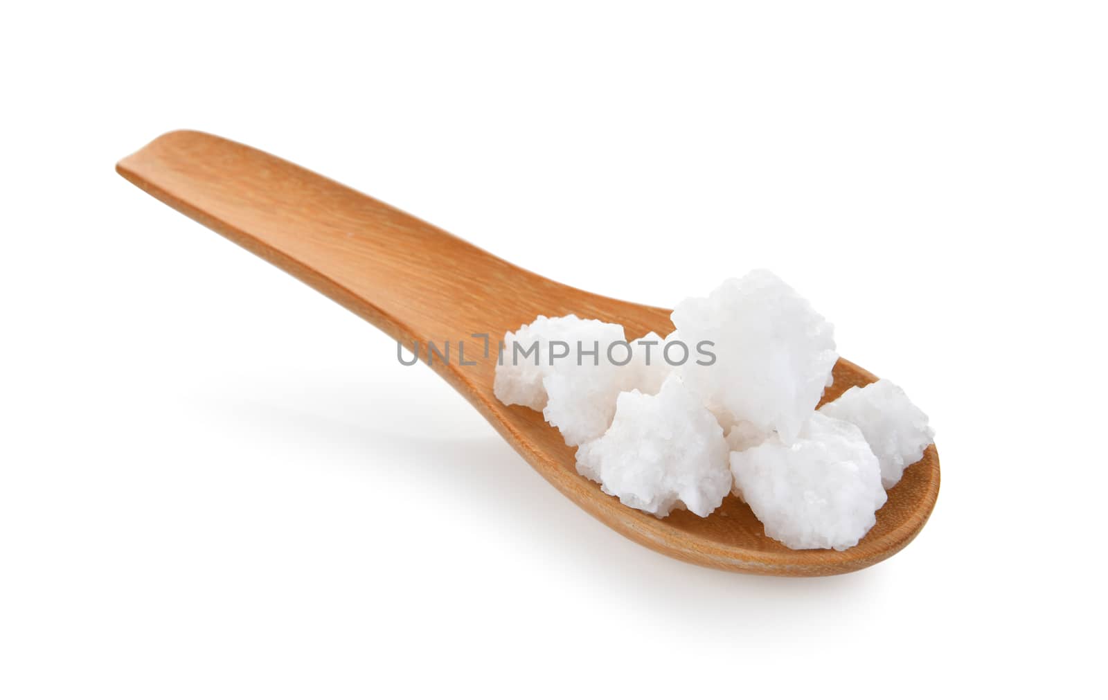 salt in wood spoon on white background by sommai