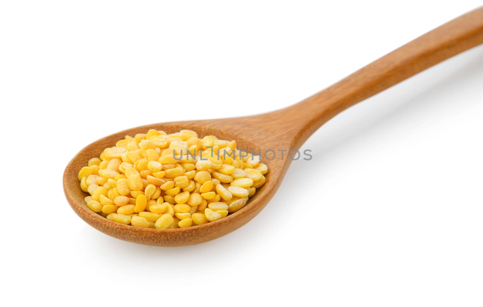 Green beans seeds in wood spoon on white background
