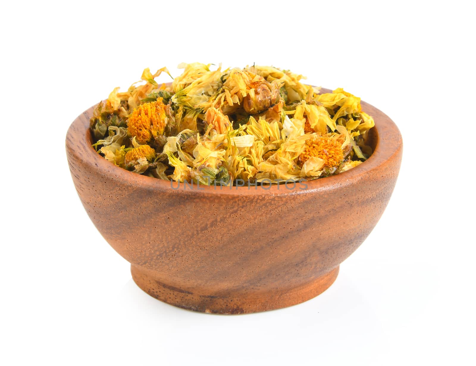 dried chrysanthemum flowers inj wood bowl on white background