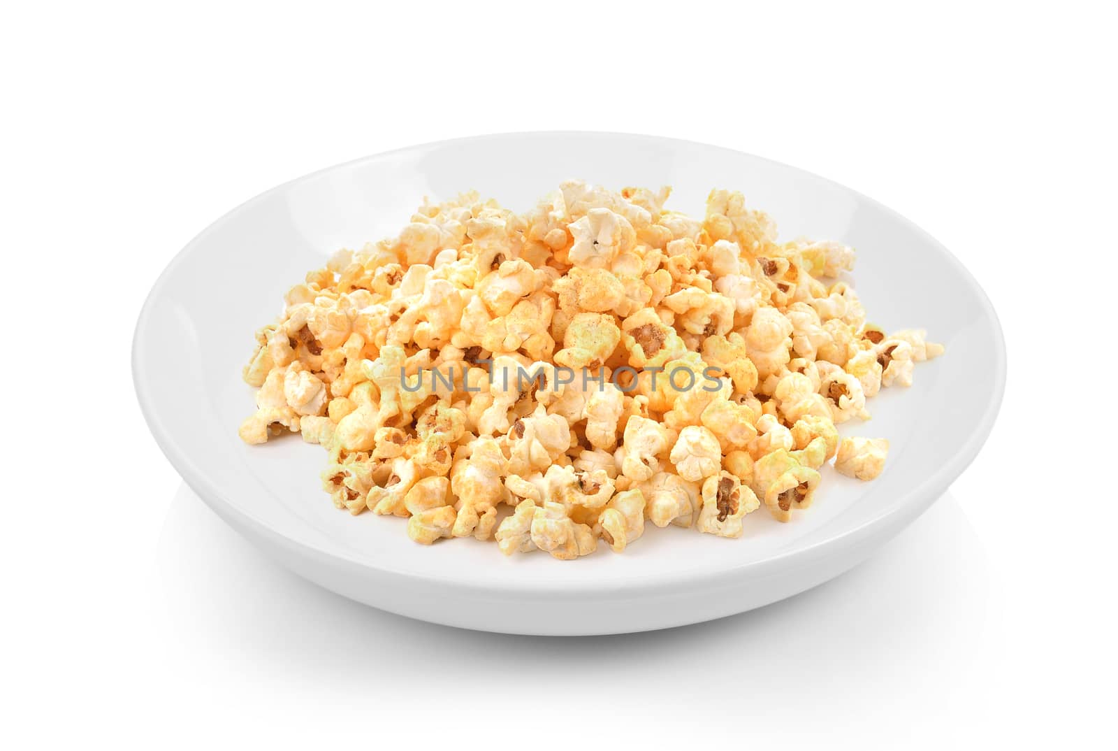 Popcorn in plate on white background by sommai