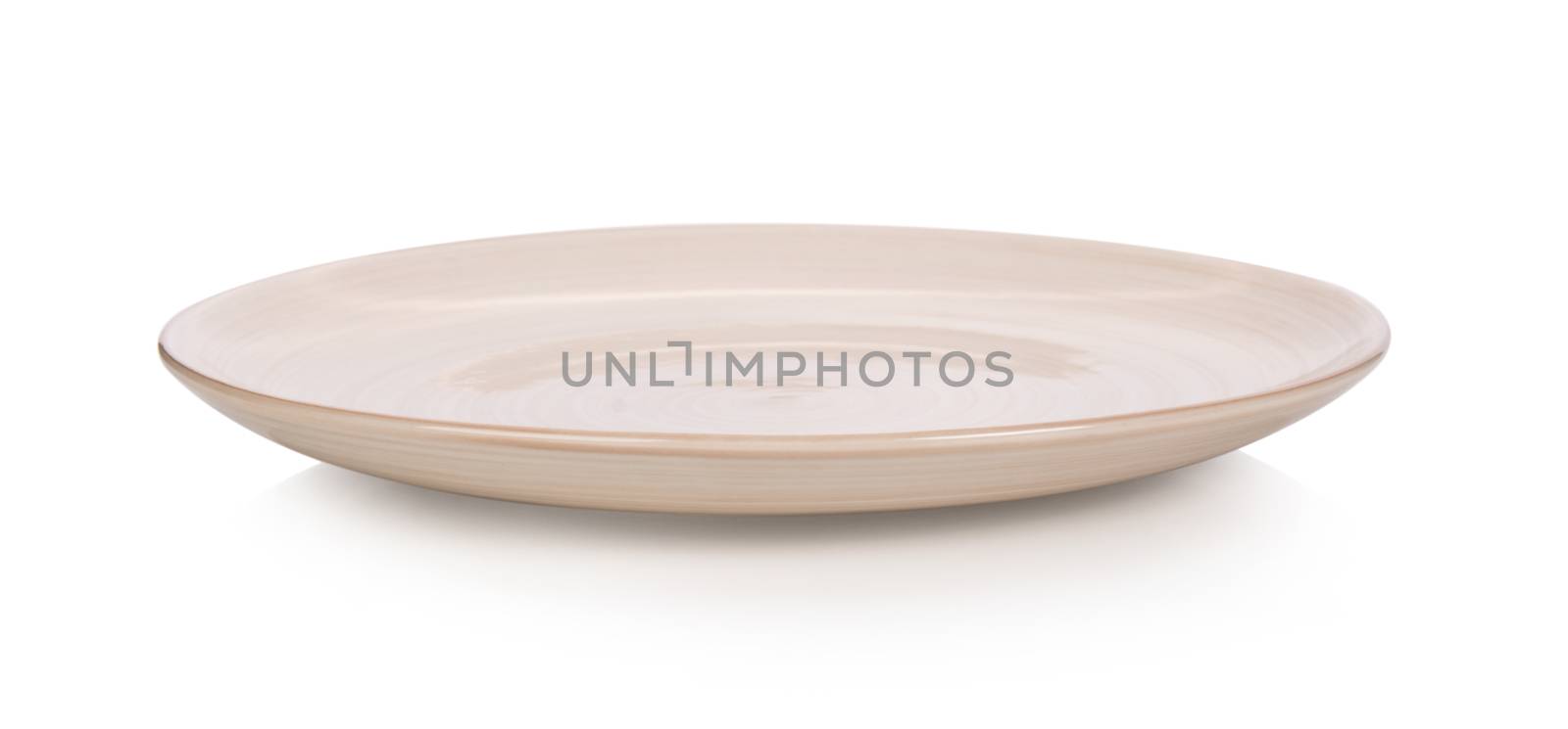 Empty plate on white background by sommai