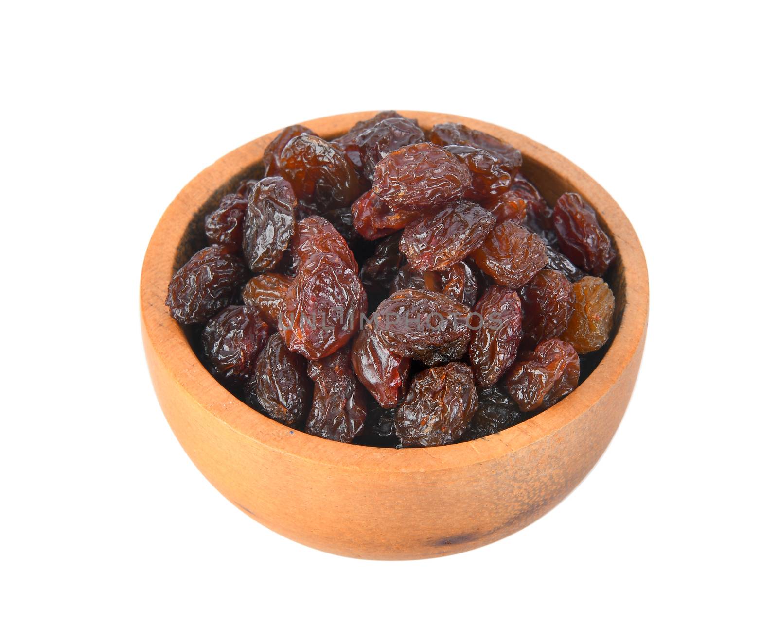 Black raisin on wood bowl isolated on white background by sommai