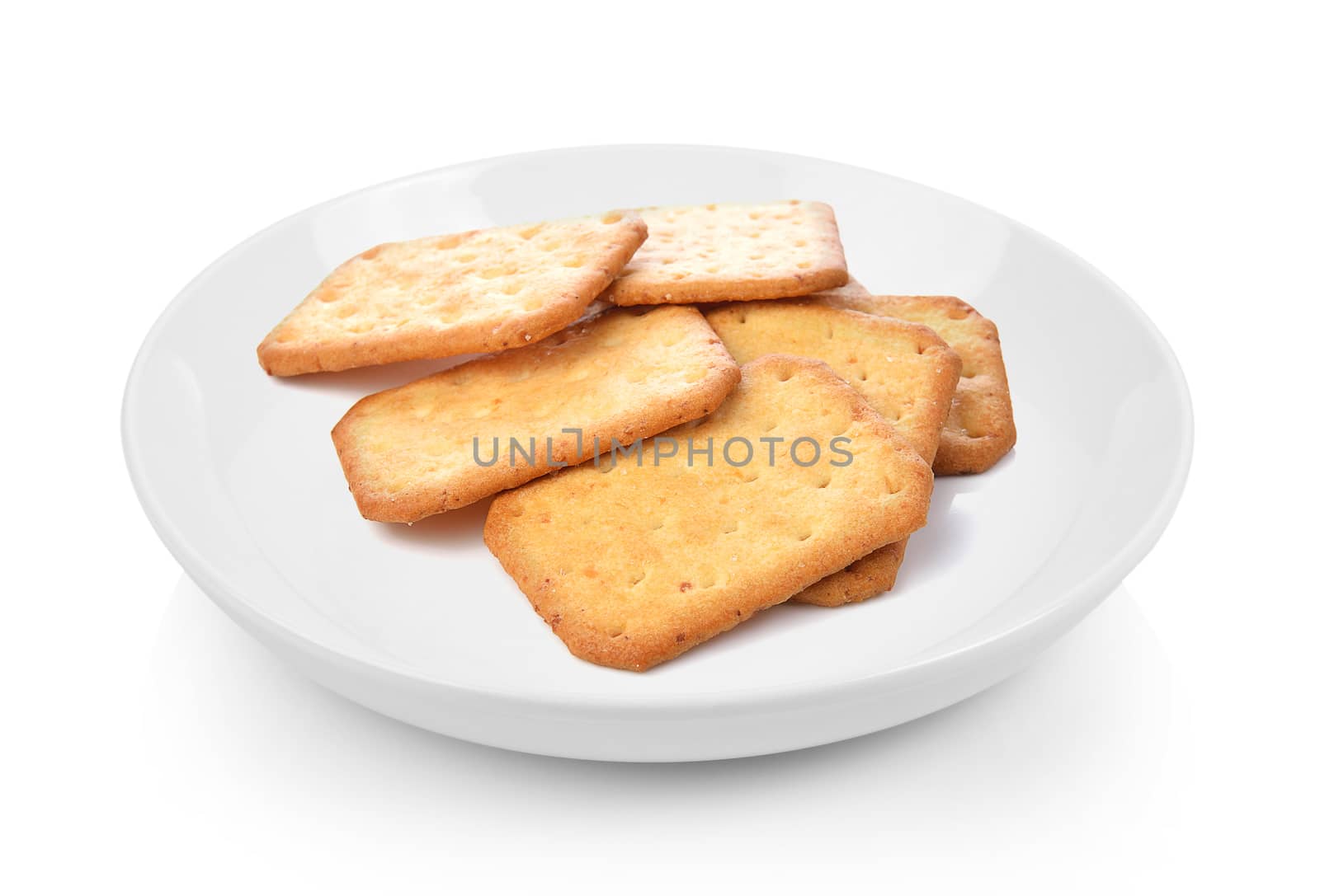 Cracker in plate on white background