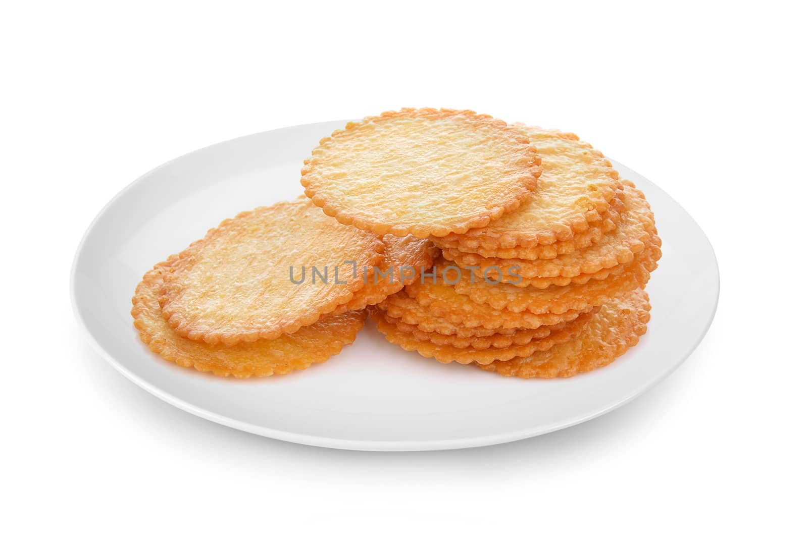 Cracker in plate isolated on white background by sommai