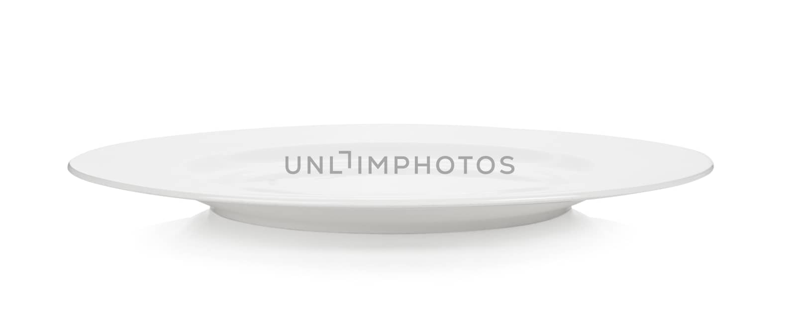 Empty plate on white background by sommai