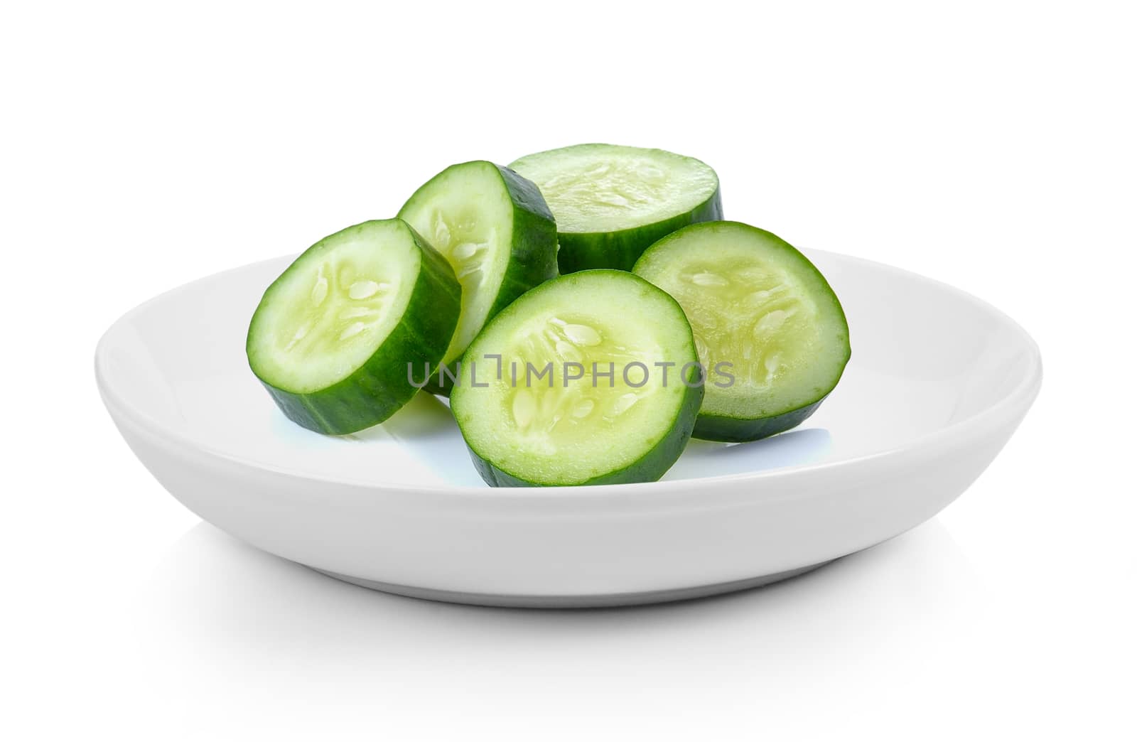 Cucumber slices in plate on white background