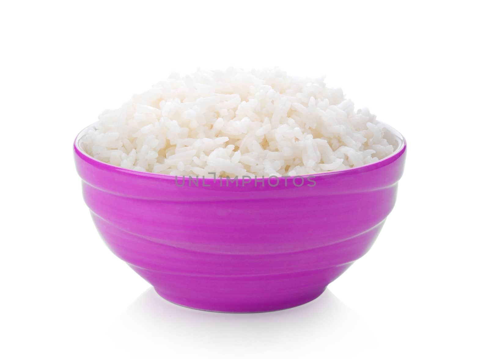 Rice cooker in a bowl on white background by sommai