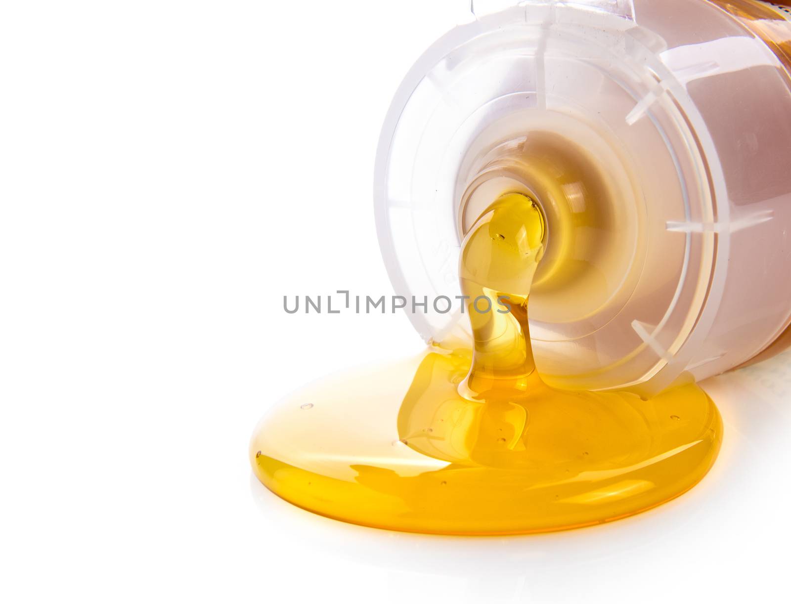 honey in plastic tube isolated on white background by sommai