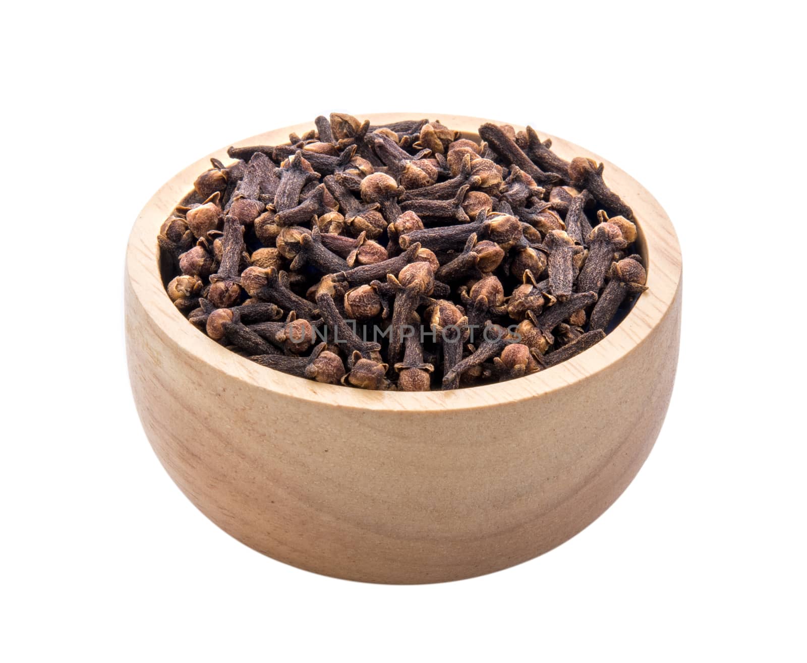 cloves spices in wood bowl on white background  by sommai