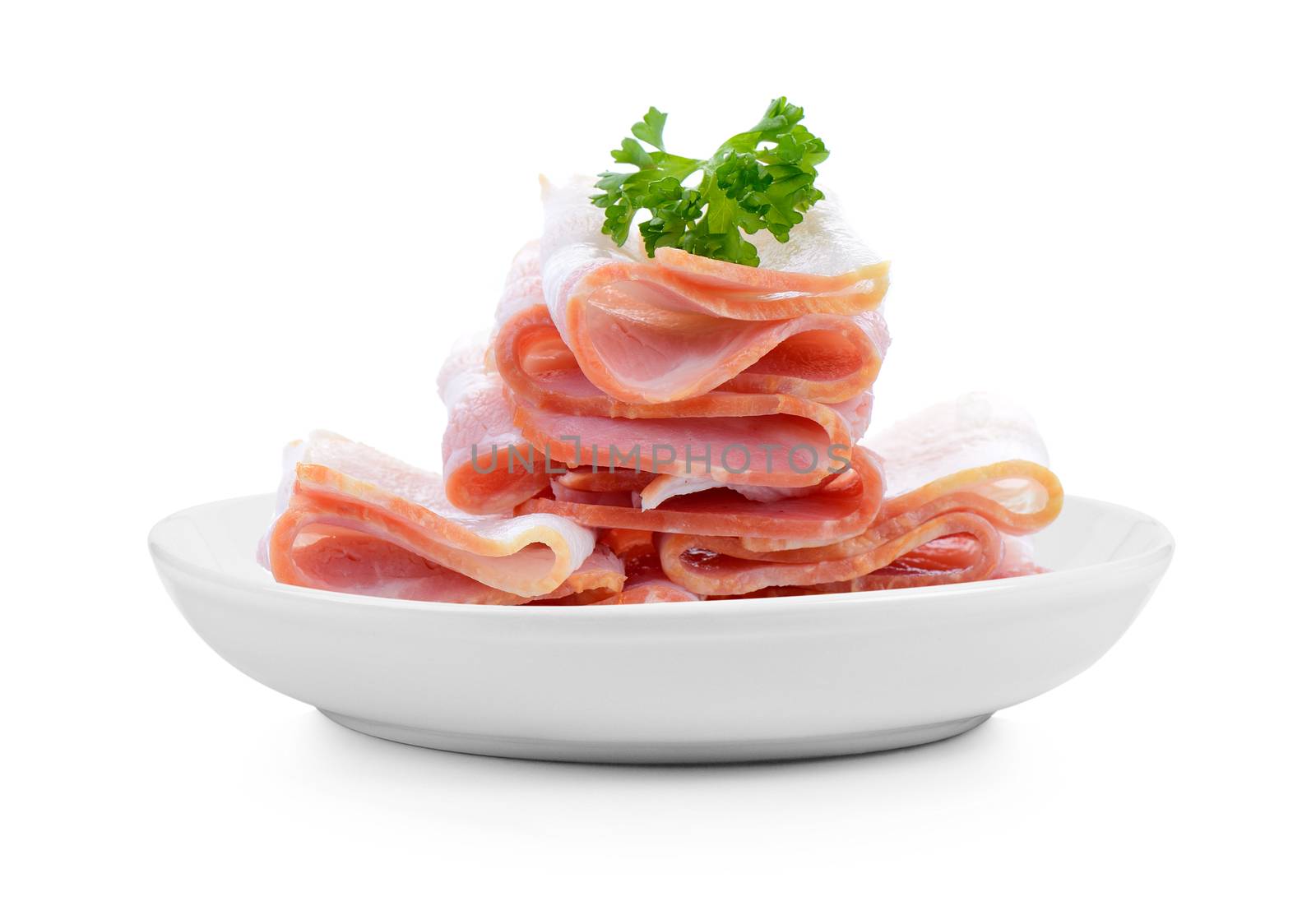 bacon in plate on white background by sommai