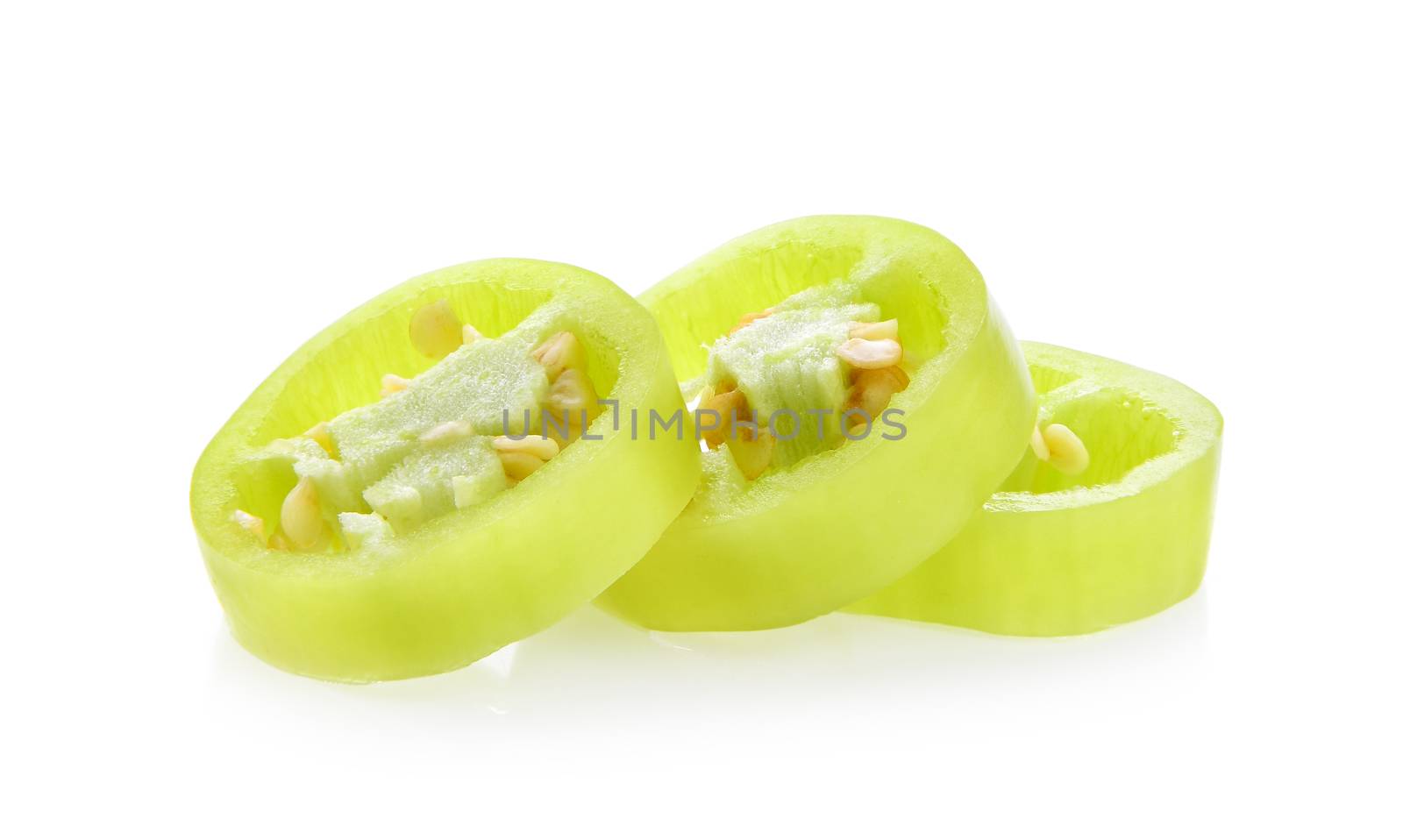 slice green hot chili pepper isolated on the white background. by sommai