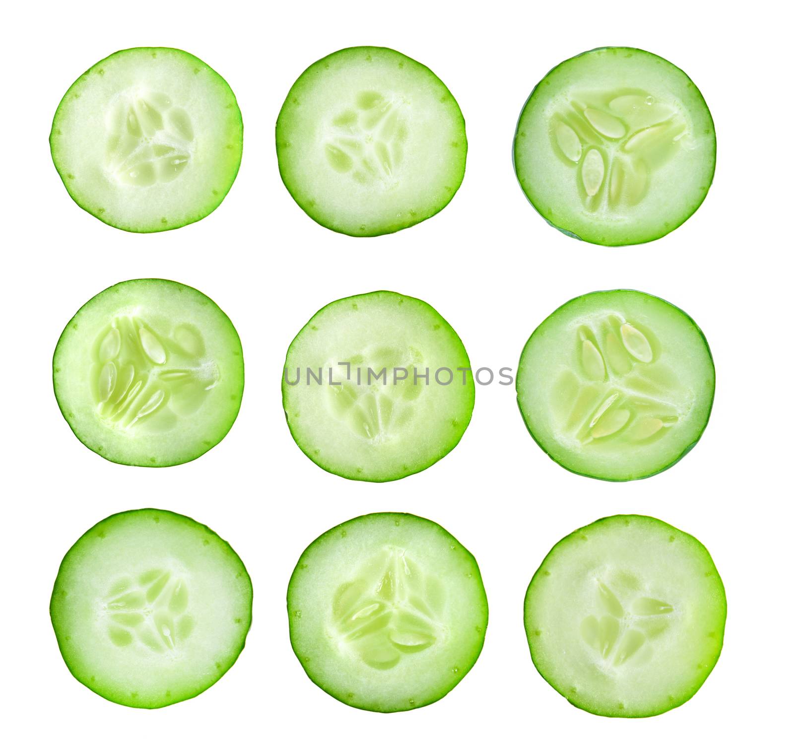Cucumber slices isolated on white background. Top view by sommai