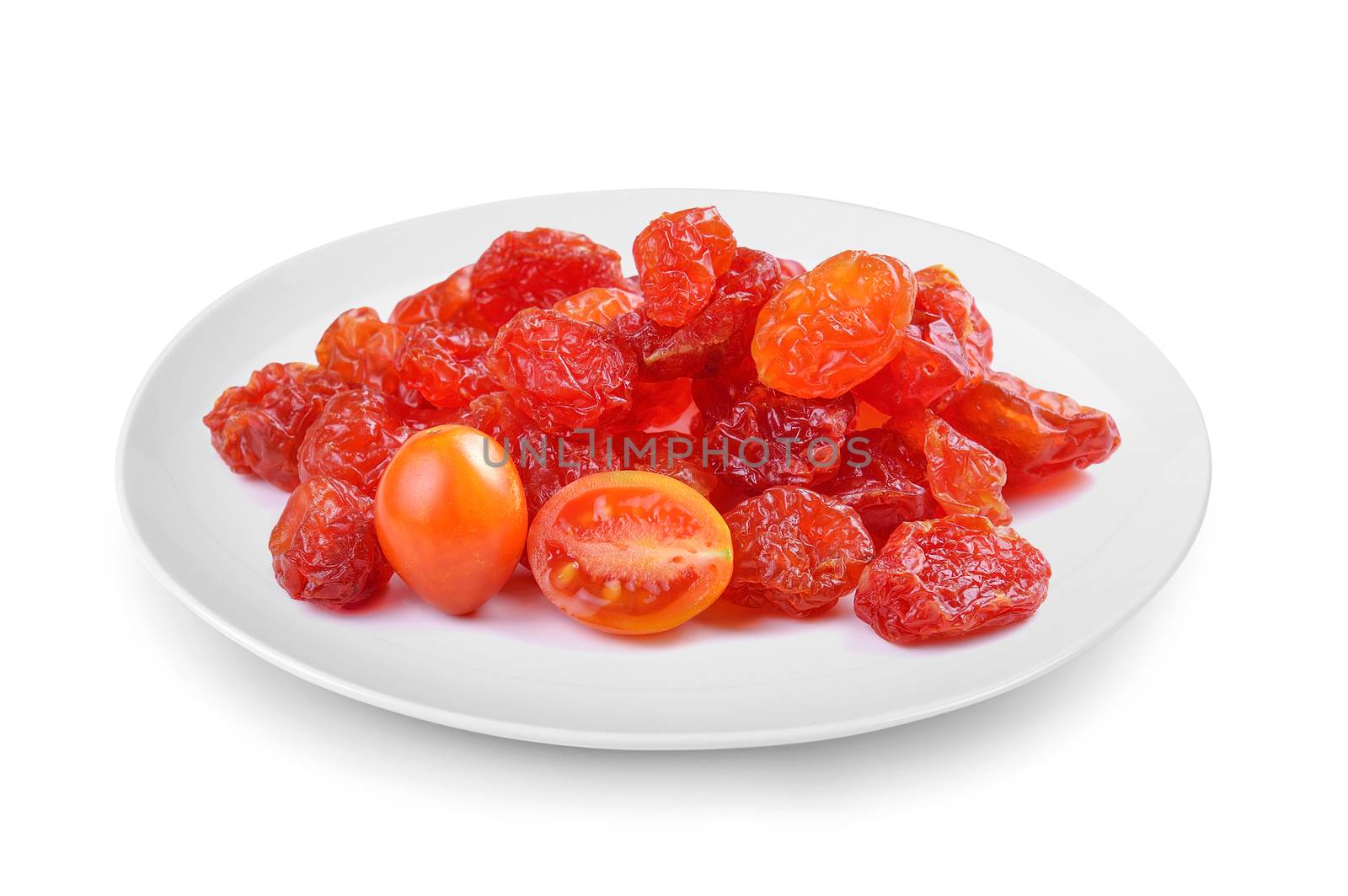 dried tomato in plate isolated on white background