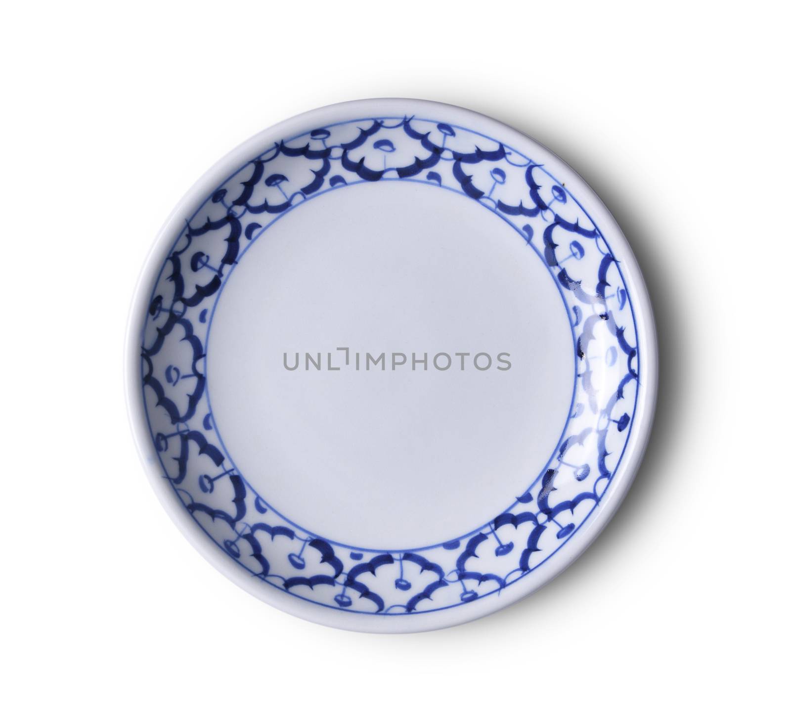 ceramic plate on white background. top view