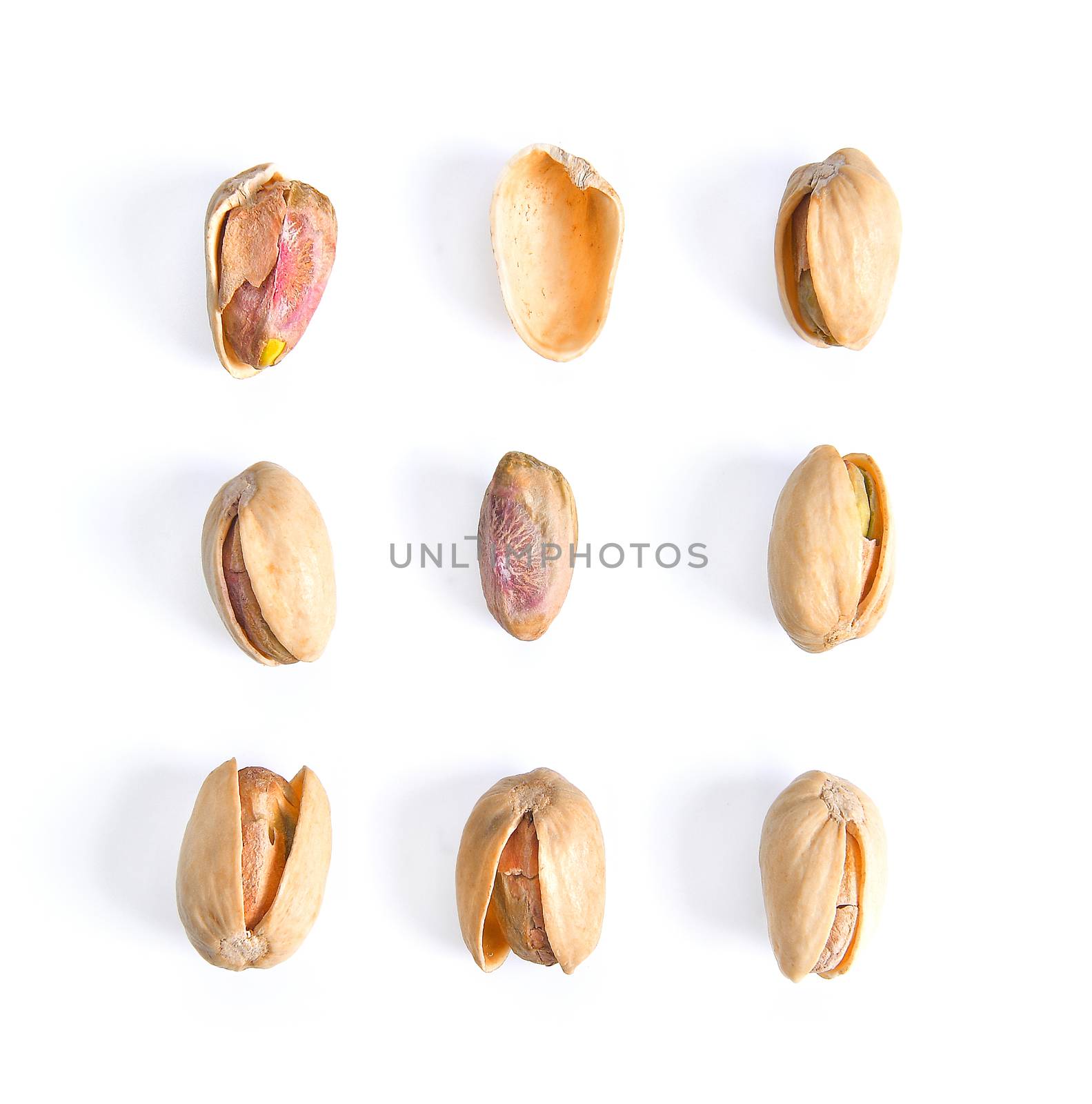 Pistachios isolated on white background, top view.