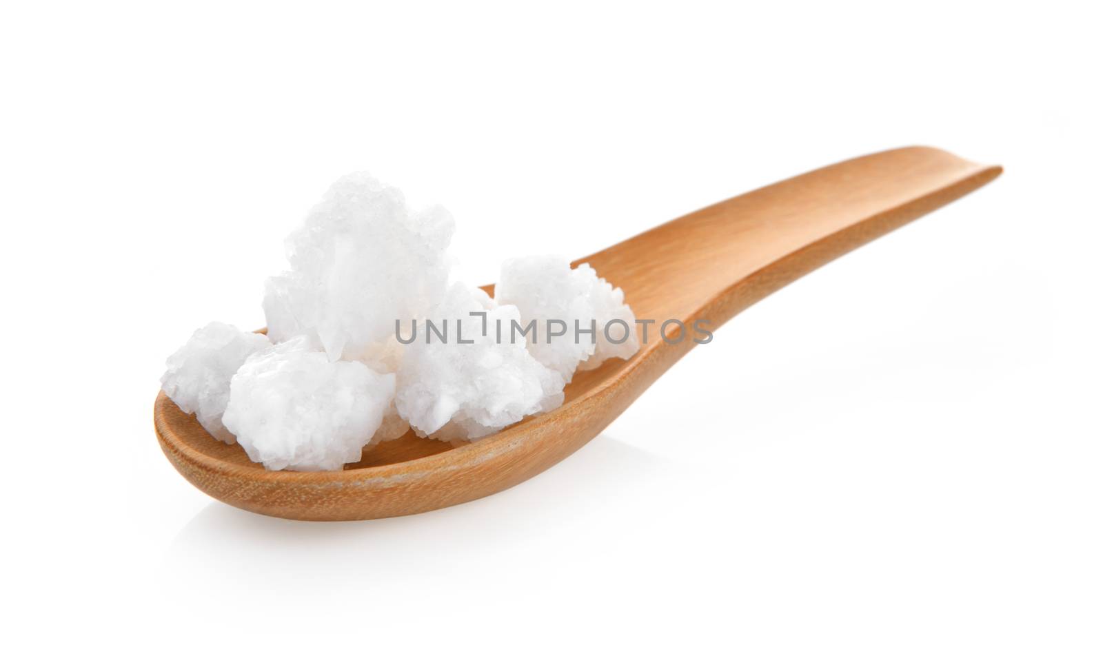 salt in wood spoon on white background