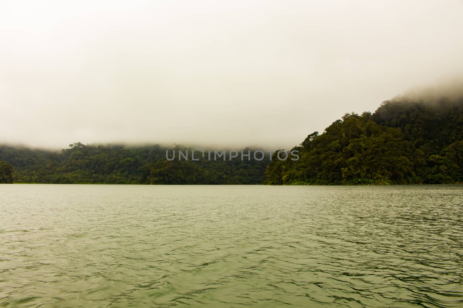 Two identical mountain lakes that are on top of the mountains on the island of Negros. Fog.