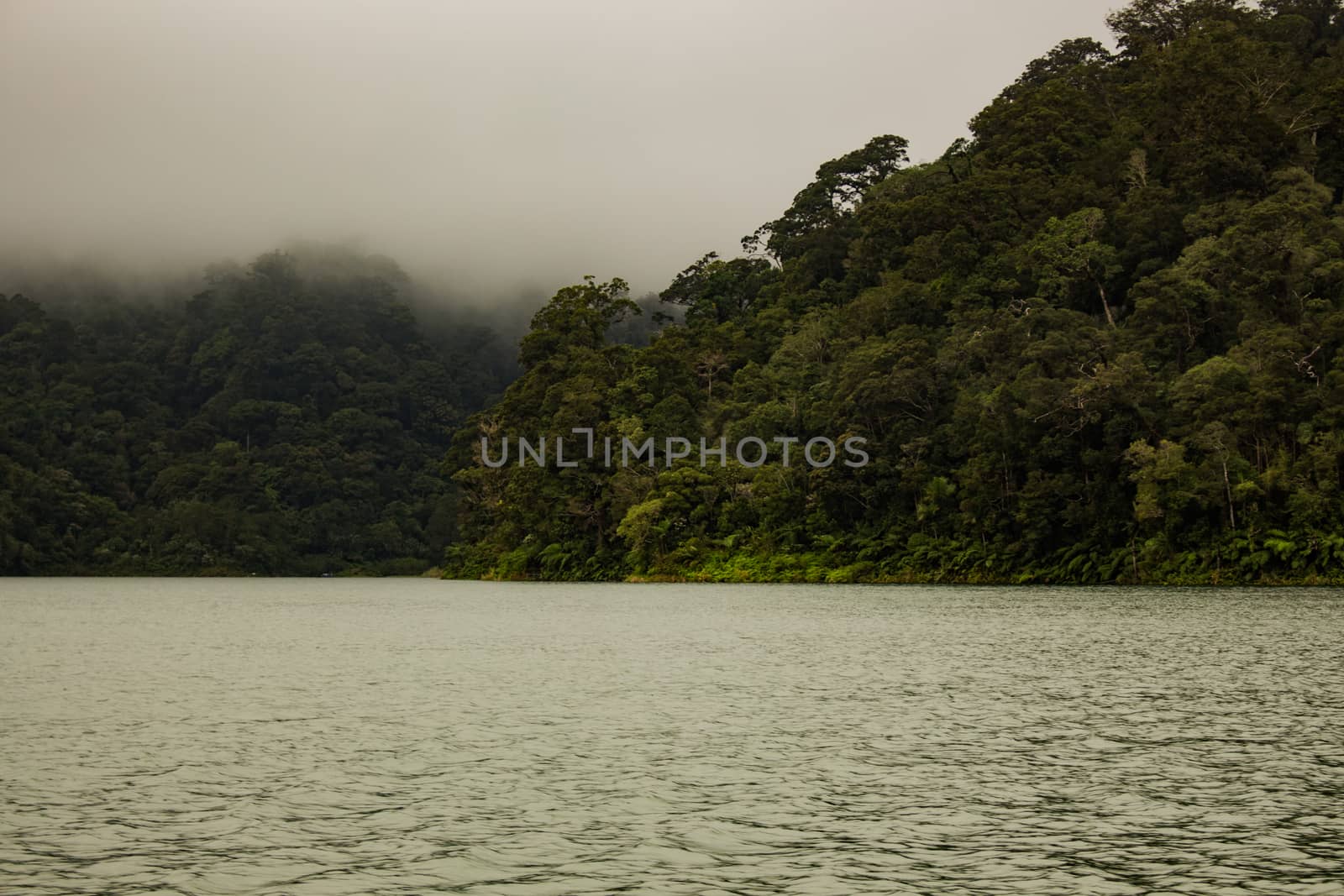 Two identical mountain lakes that are on top of the mountains on the island of Negros. Fog.