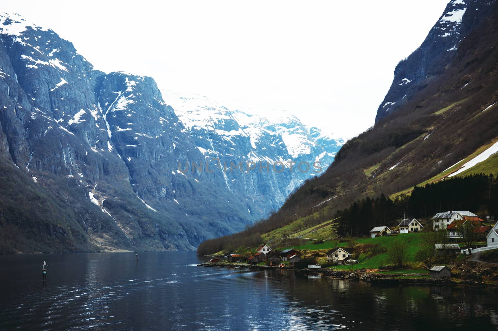 Flam, Norway, Europe. Beautiful Norwegian countryside with reflection of the mountains on the river