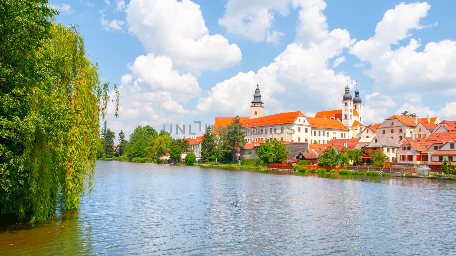 Telc Panorama. Water reflection of houses and Telc Castle, Czech Republic. UNESCO World Heritage Site.