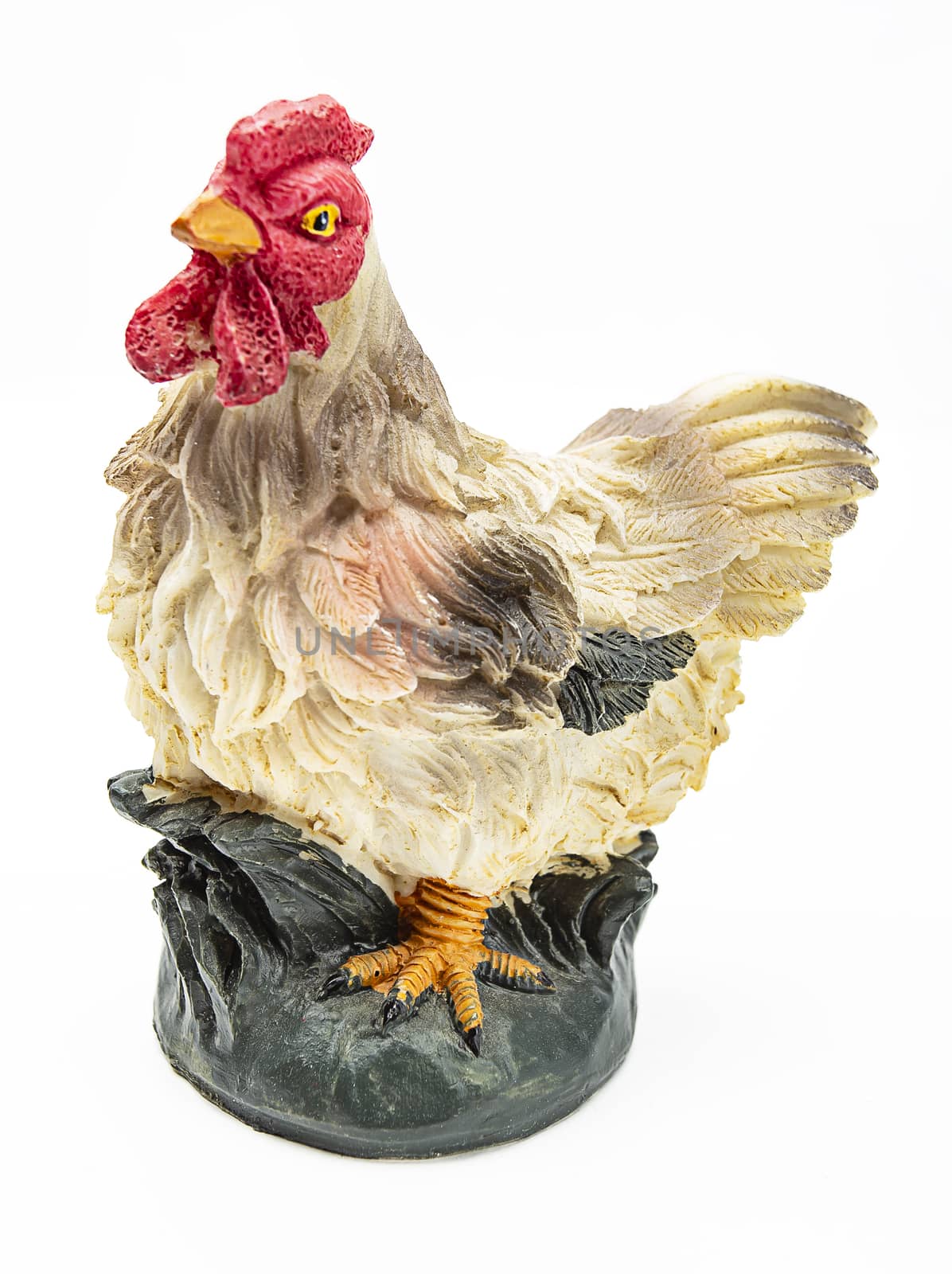 Isolated chicken figurine on a white background