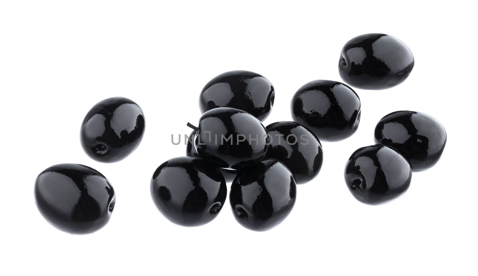 Heap of black olives isolated on white background with clipping path, close up