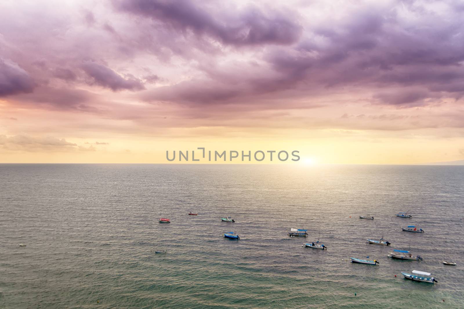 Puerto Vallarta, a resort town in Mexico, is famous by it's sunsets. This picture was taken above Los Muertos beach, close to the pier called Mirador.