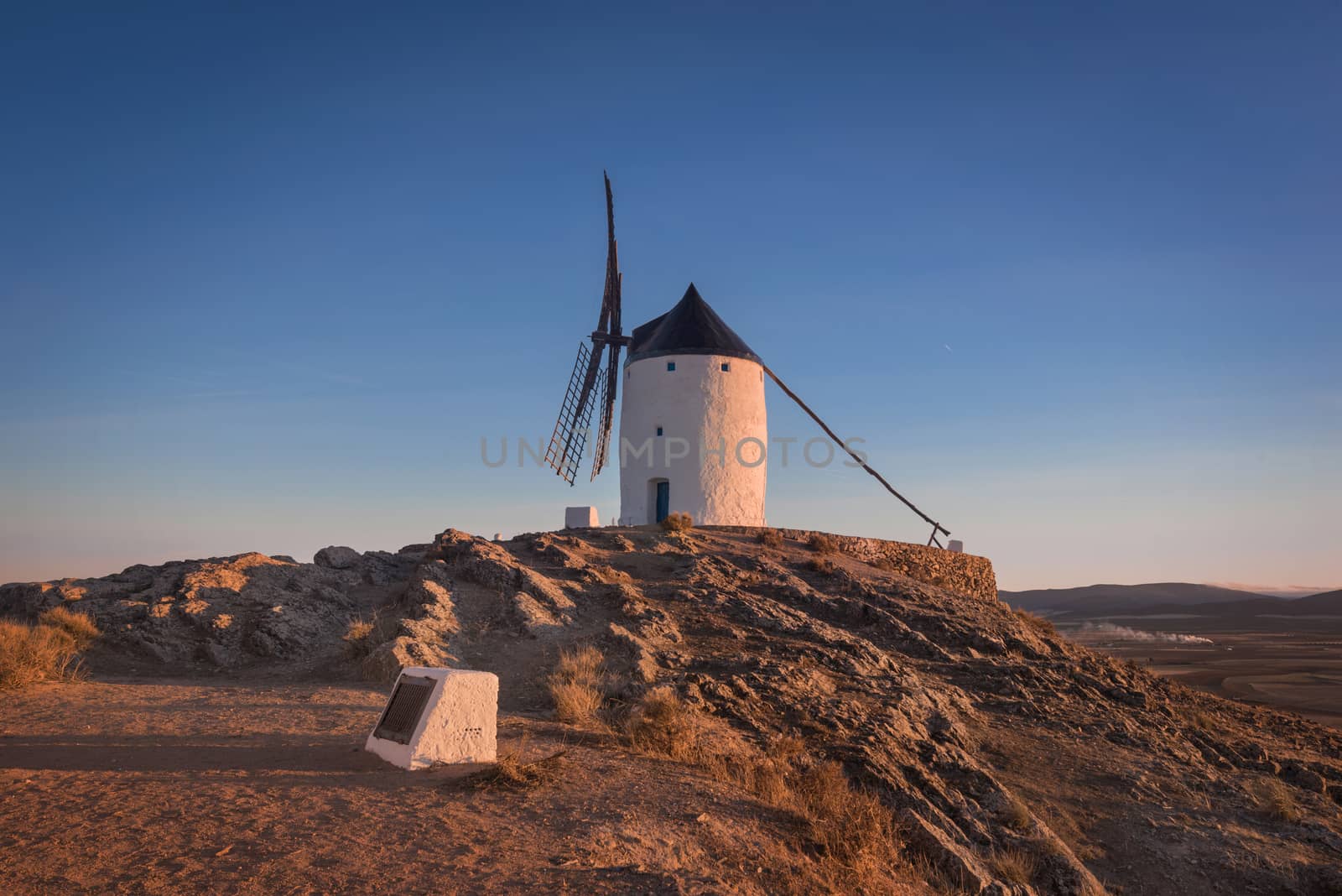 Don Quixote windmills at sunset. Famous landmark in Consuegra, Toledo Spain.