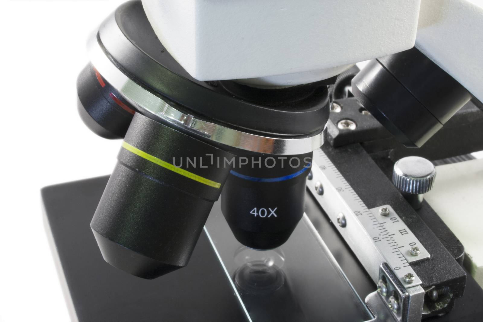 Close up view of a Microscope over white isolated background