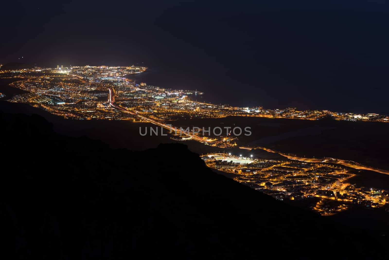 Aerial night scene of Adeje village and las Americas touristic resort, Tenerife, Canary islands, Spain.