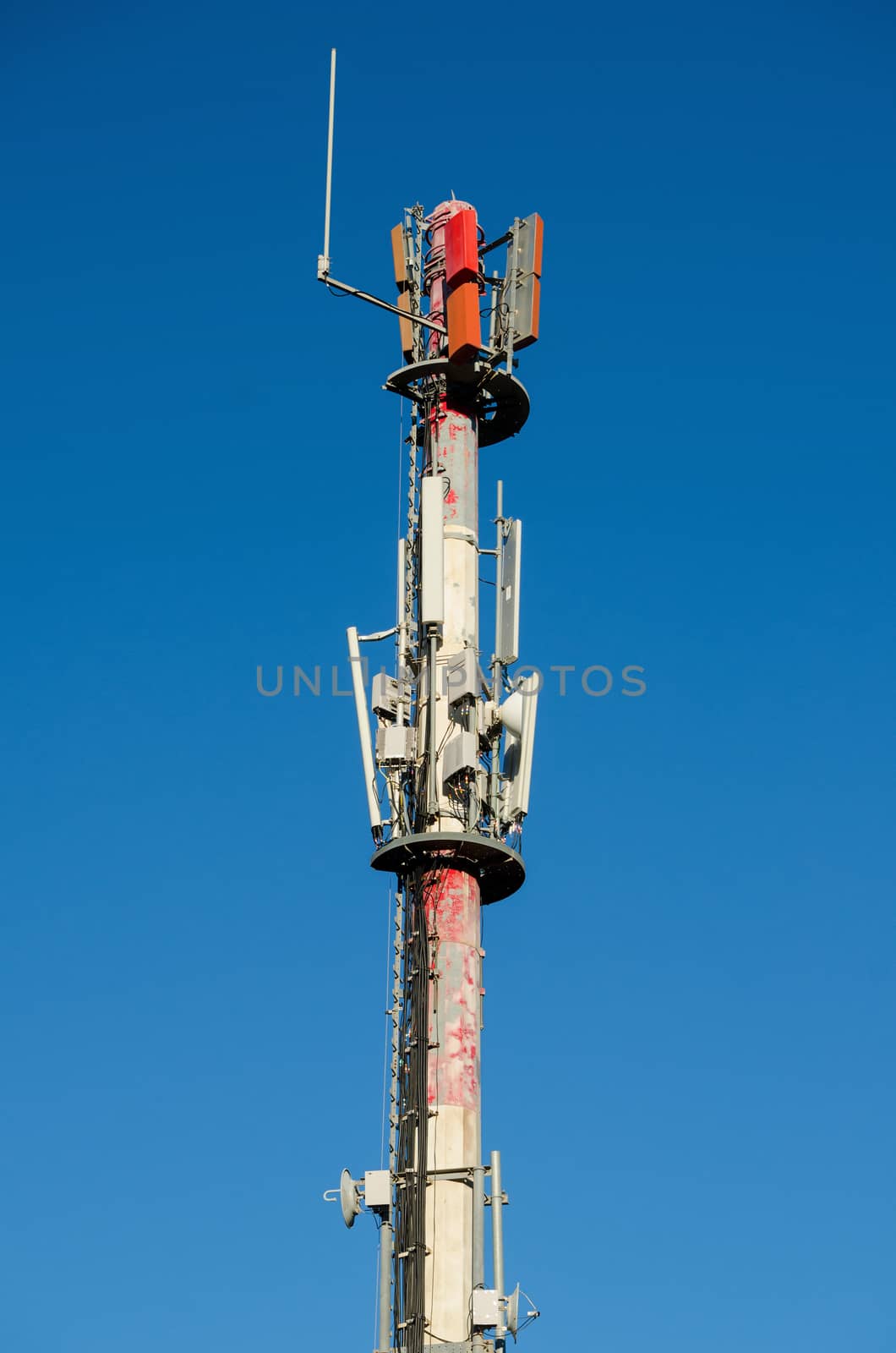 Mobile antenna on blue sky background