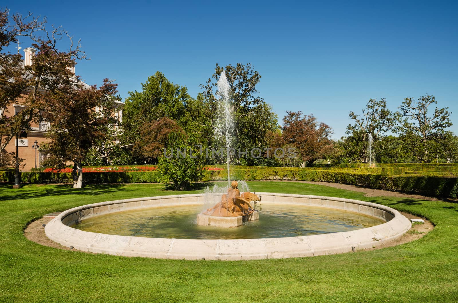 Fountain and gardens of Aranjuez Royal palace in Madrid, Spain.