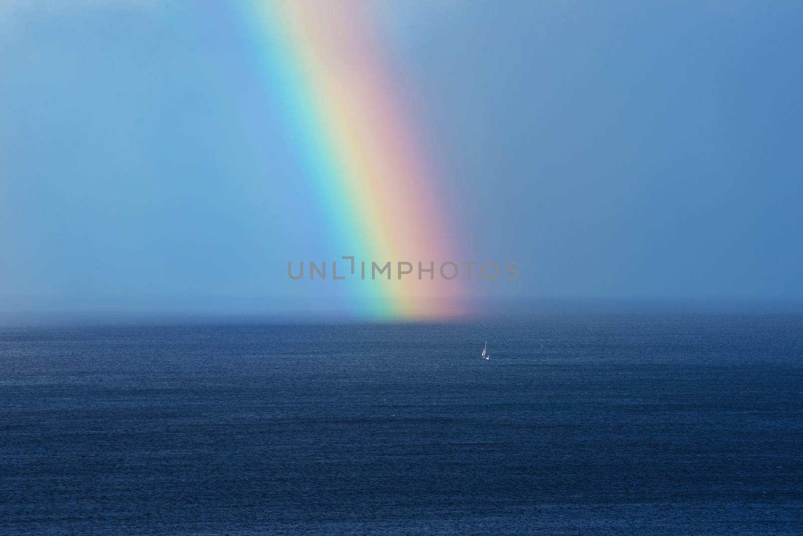 Beautiful rainbow on the ocean horizon by HERRAEZ