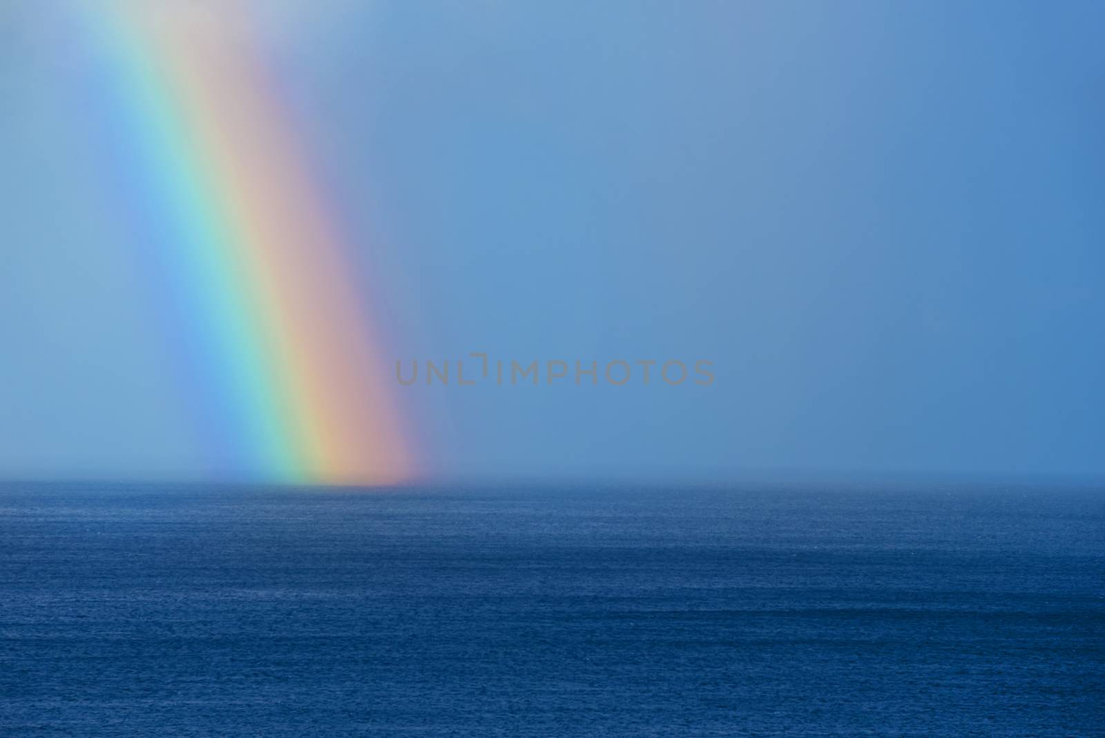 Beautiful rainbow on the ocean horizon by HERRAEZ