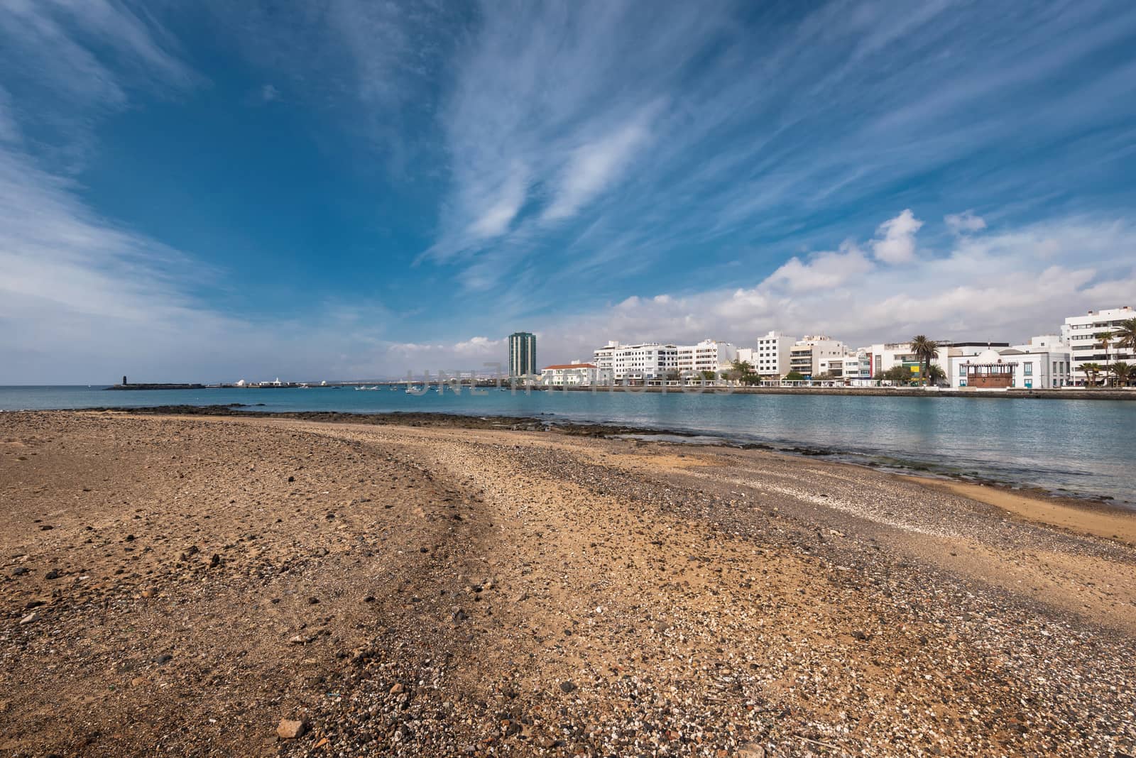 Arrecife coast and skyline in Lanzarote, Canary islands, Spain. by HERRAEZ