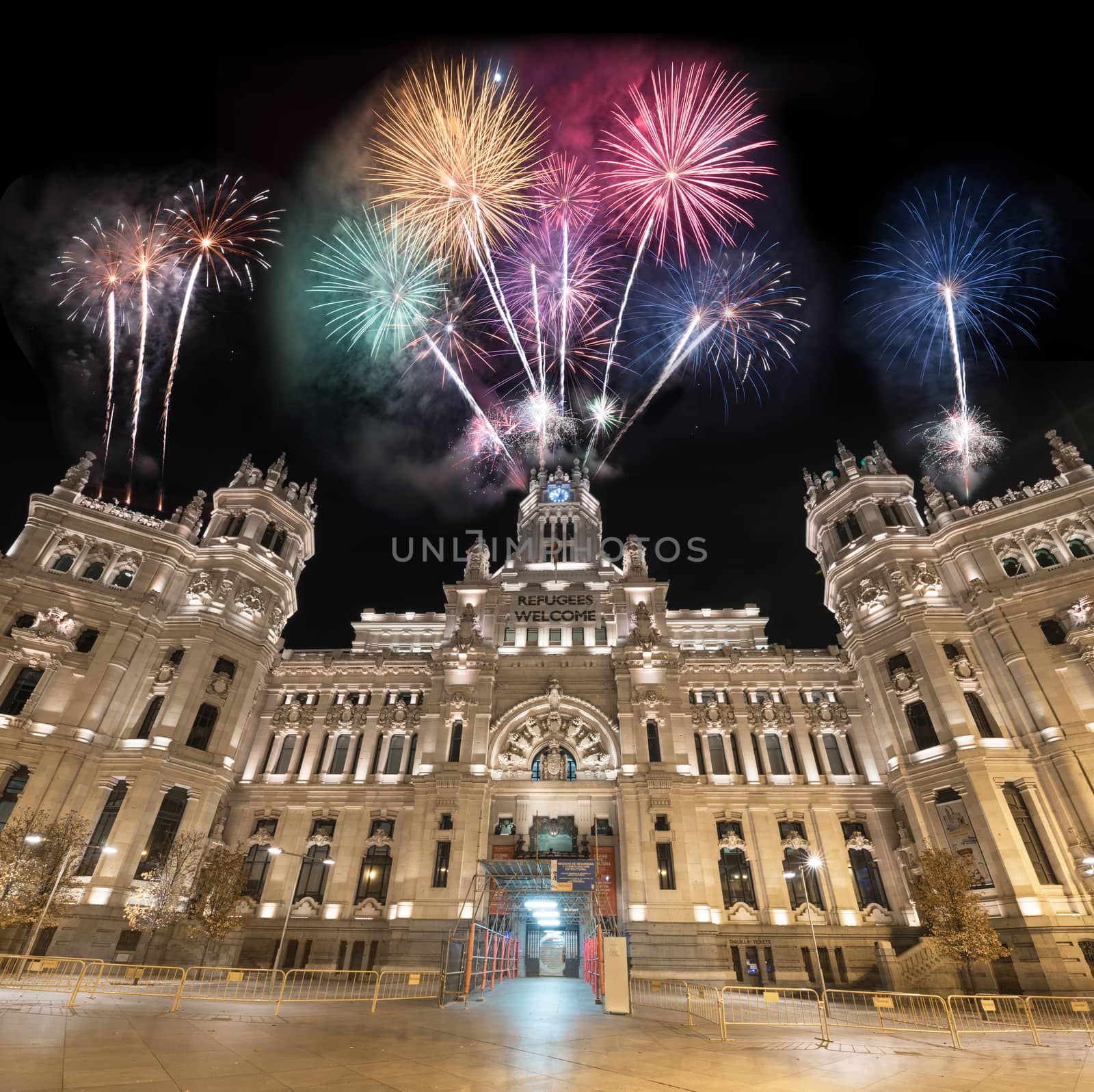 Cibeles Palace night scene fireworks display celebration, (Palacio de Cibeles) is the City Hall of Madrid. by HERRAEZ