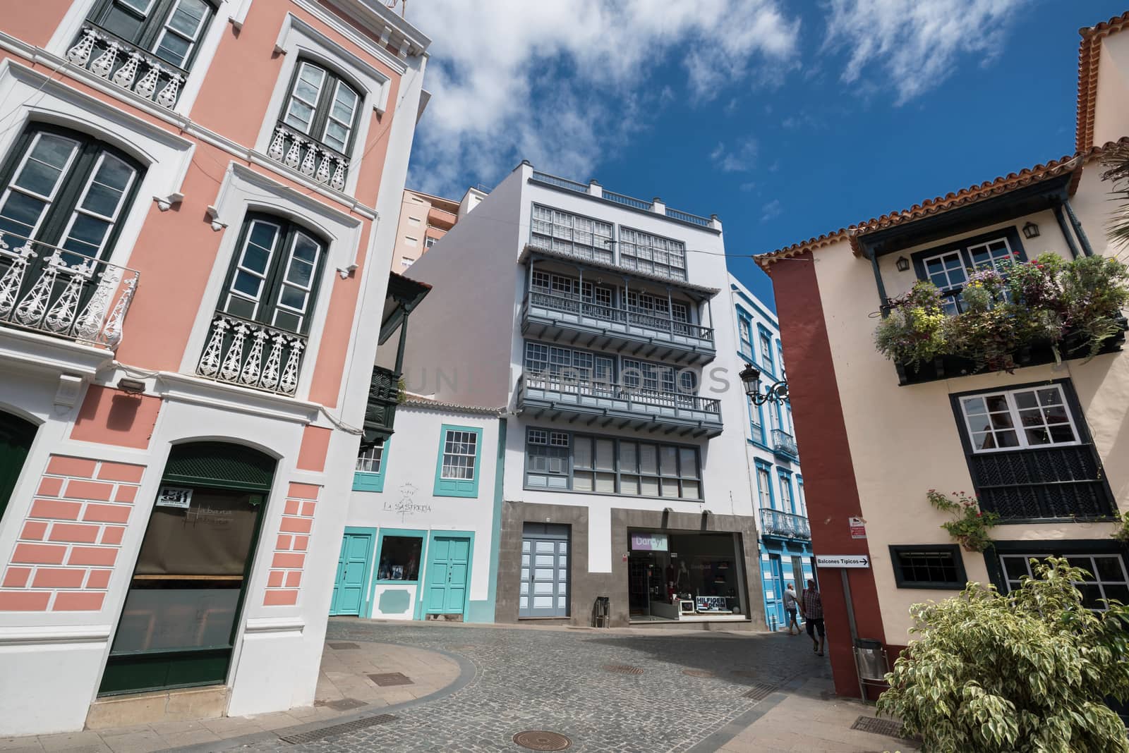 Famous ancient colorful colonies balconies decorated with flowers. Colonial houses facades in Santa Cruz, La Palma island in Spain