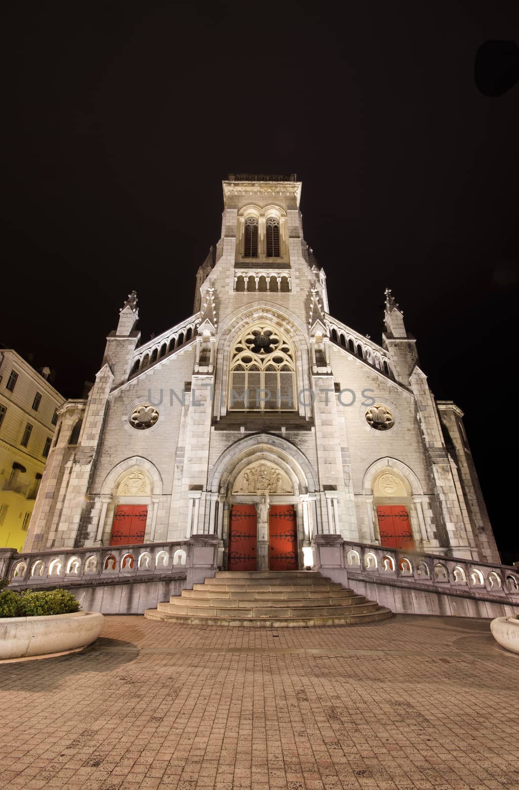 Scenic view of Saint Charles church at night in Biarritz, France. by HERRAEZ