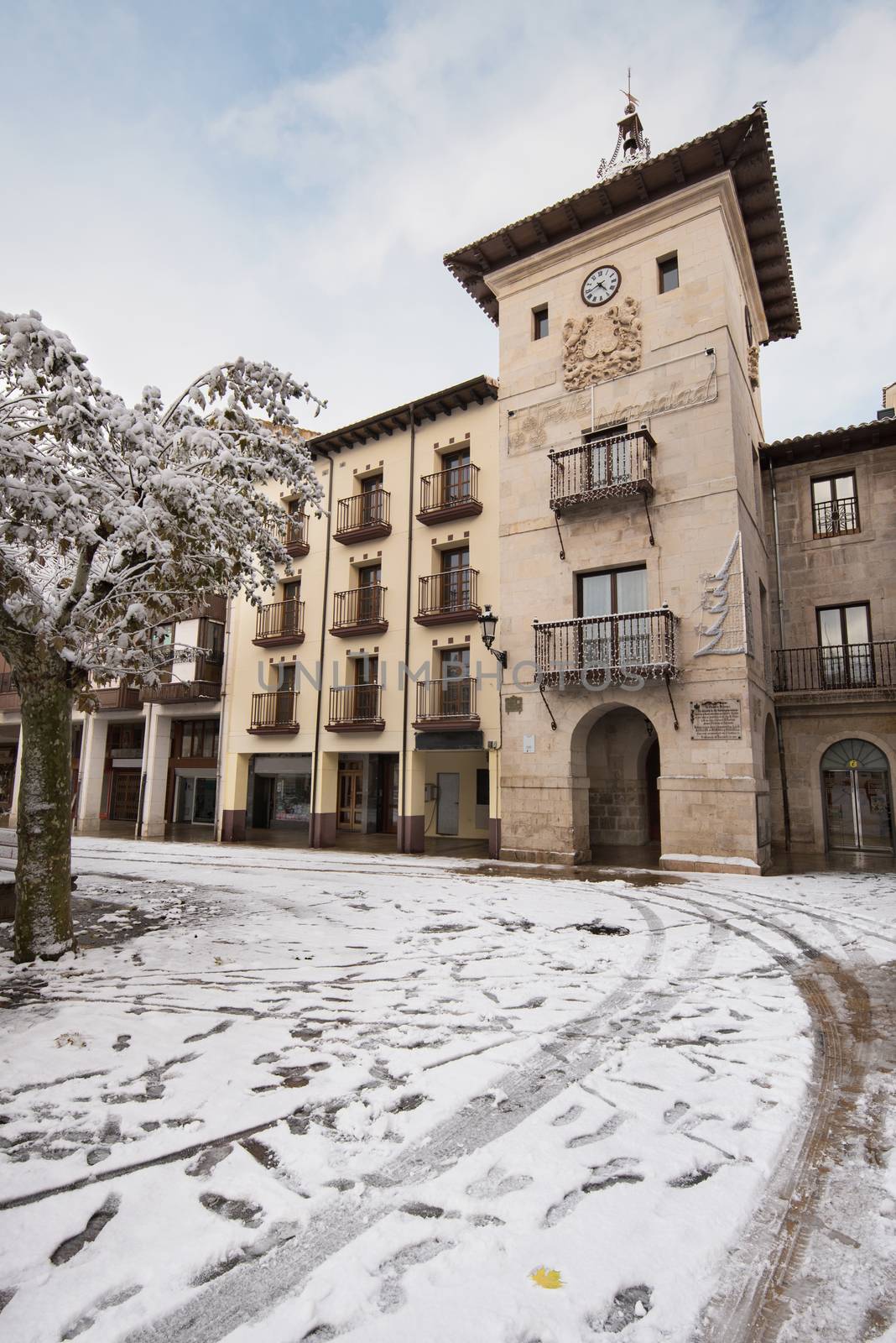 Winter scene of a snowed cityscape landscape of the ancient village of Briviesca in Burgos Province, Castilla y Leon, Spain.