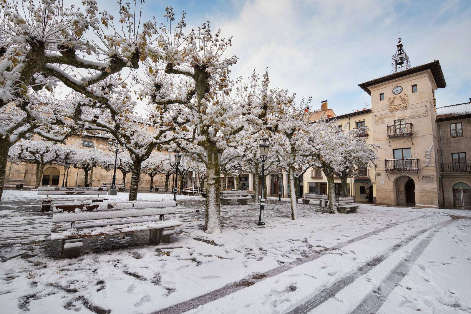 Winter scene of a snowed cityscape landscape of the ancient vill by HERRAEZ