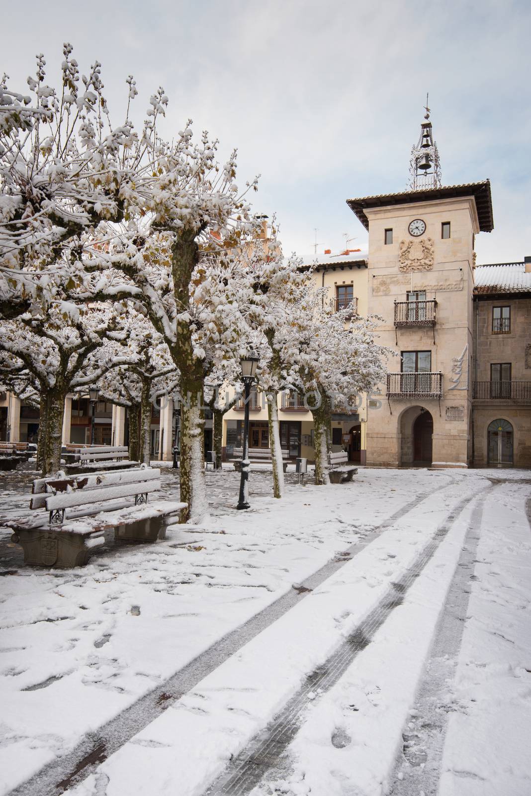Winter scene of a snowed cityscape landscape of the ancient village of Briviesca in Burgos Province, Castilla y Leon, Spain. by HERRAEZ