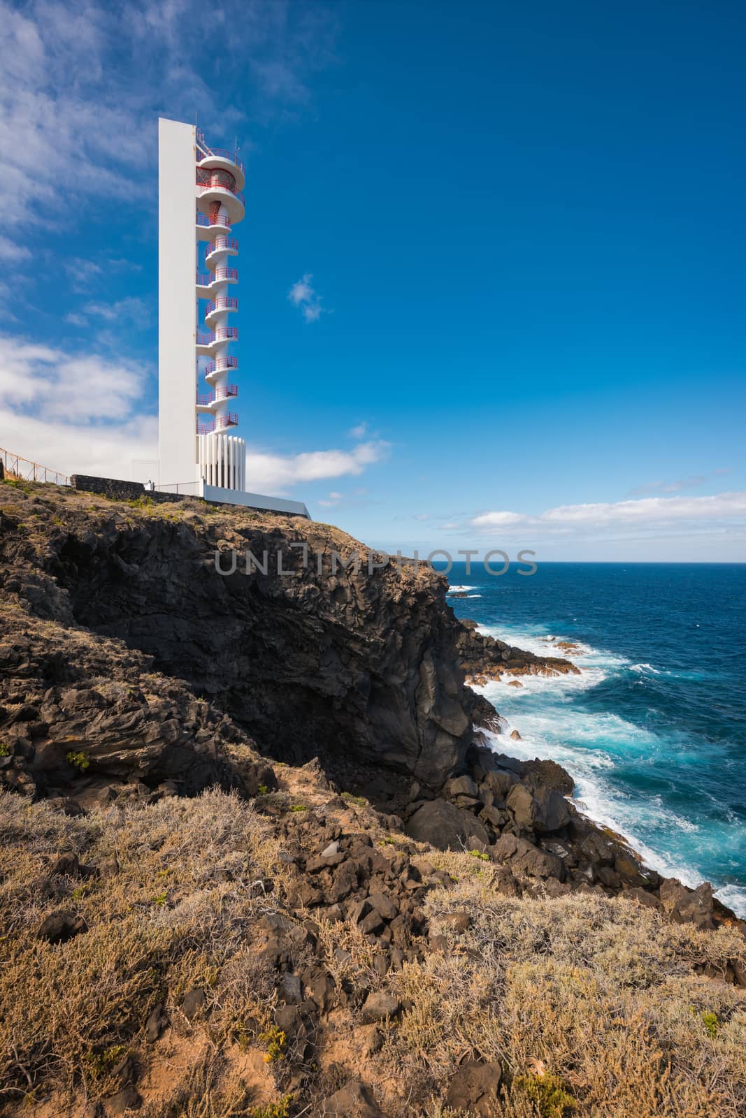 Coast landscape and lighthouse in Buenavista, north tenerife island, Canary islands, Spain. by HERRAEZ