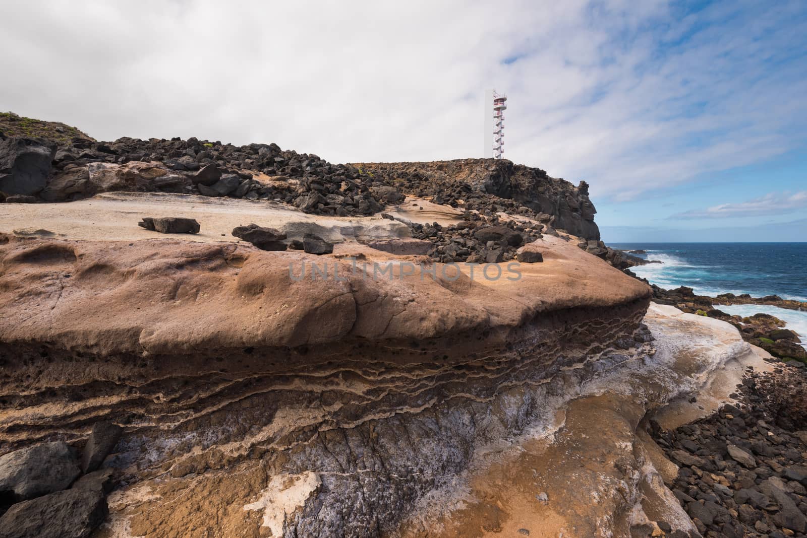 Coast landscape and lighthouse in Buenavista, north tenerife island, Canary islands, Spain. by HERRAEZ