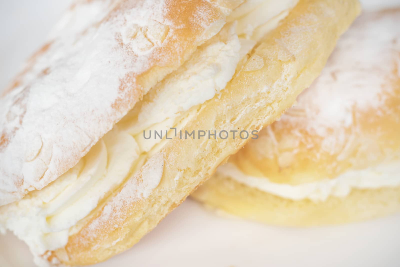 Delicious cream pastry macro picture, central selective focus. by HERRAEZ