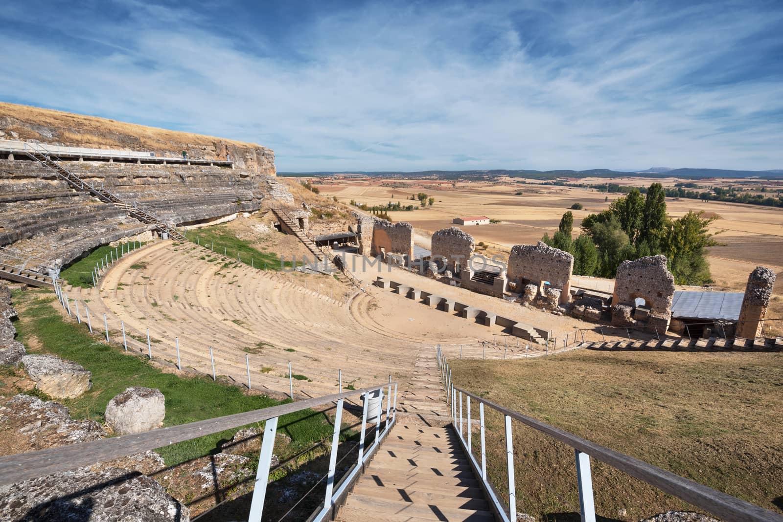 Ruins of the ancient roman amphytheater in colony Clunia Sulpicia, in Burgos, Spain.