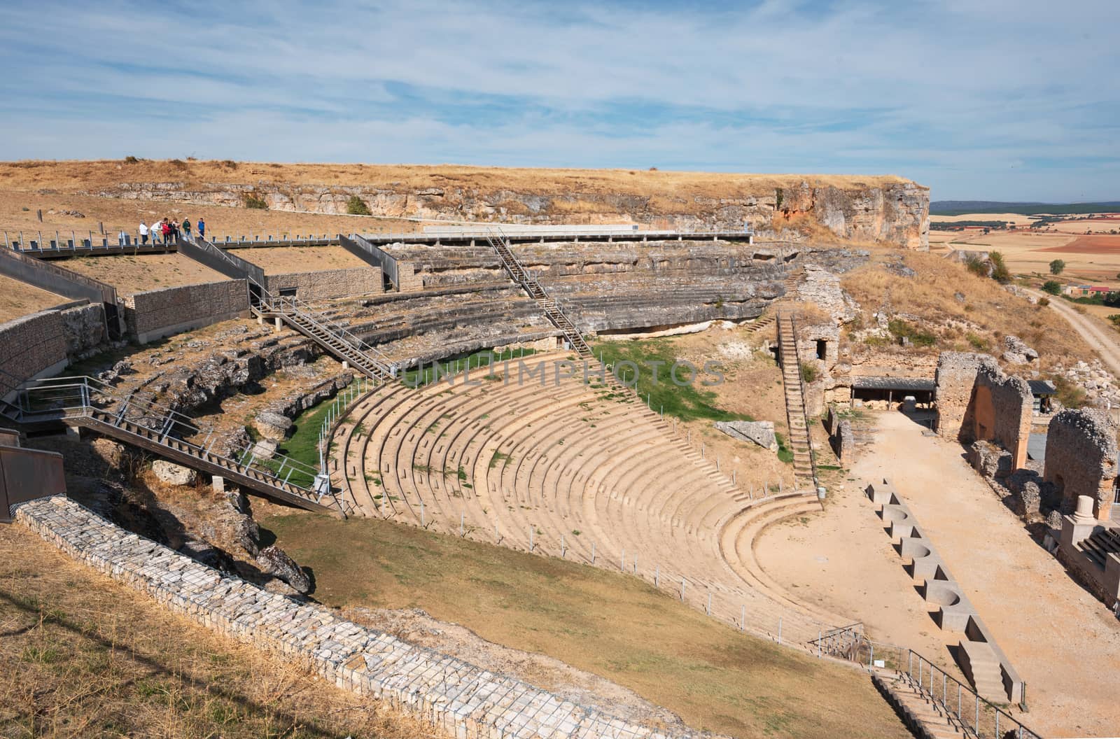 Ruins of the ancient roman anphyteather in colony Clunia Sulpicia, in Burgos, Spain. by HERRAEZ