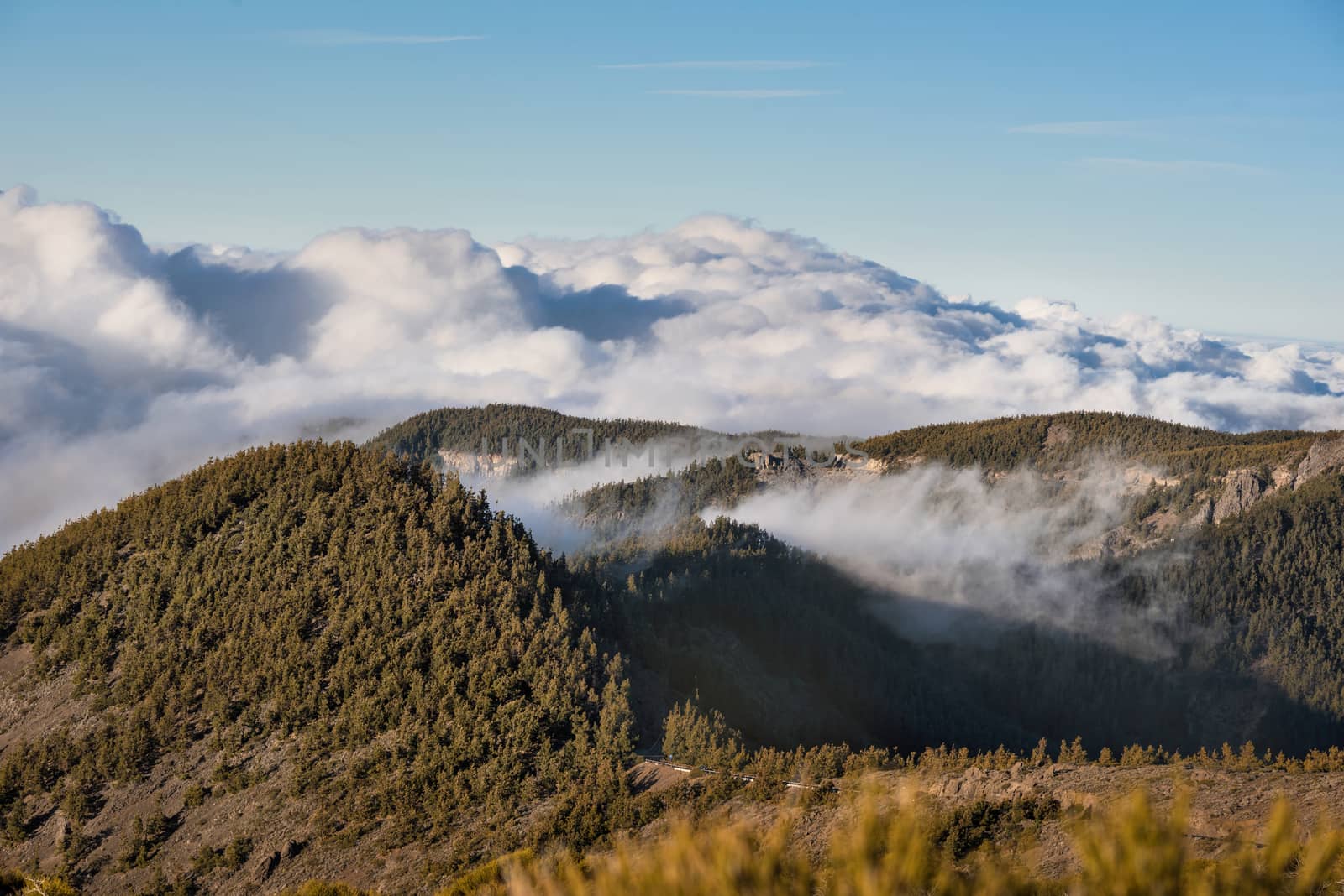 Sea of clouds in volcanic landscape of Teide national park, Tenerife, Canary islands, Spain.