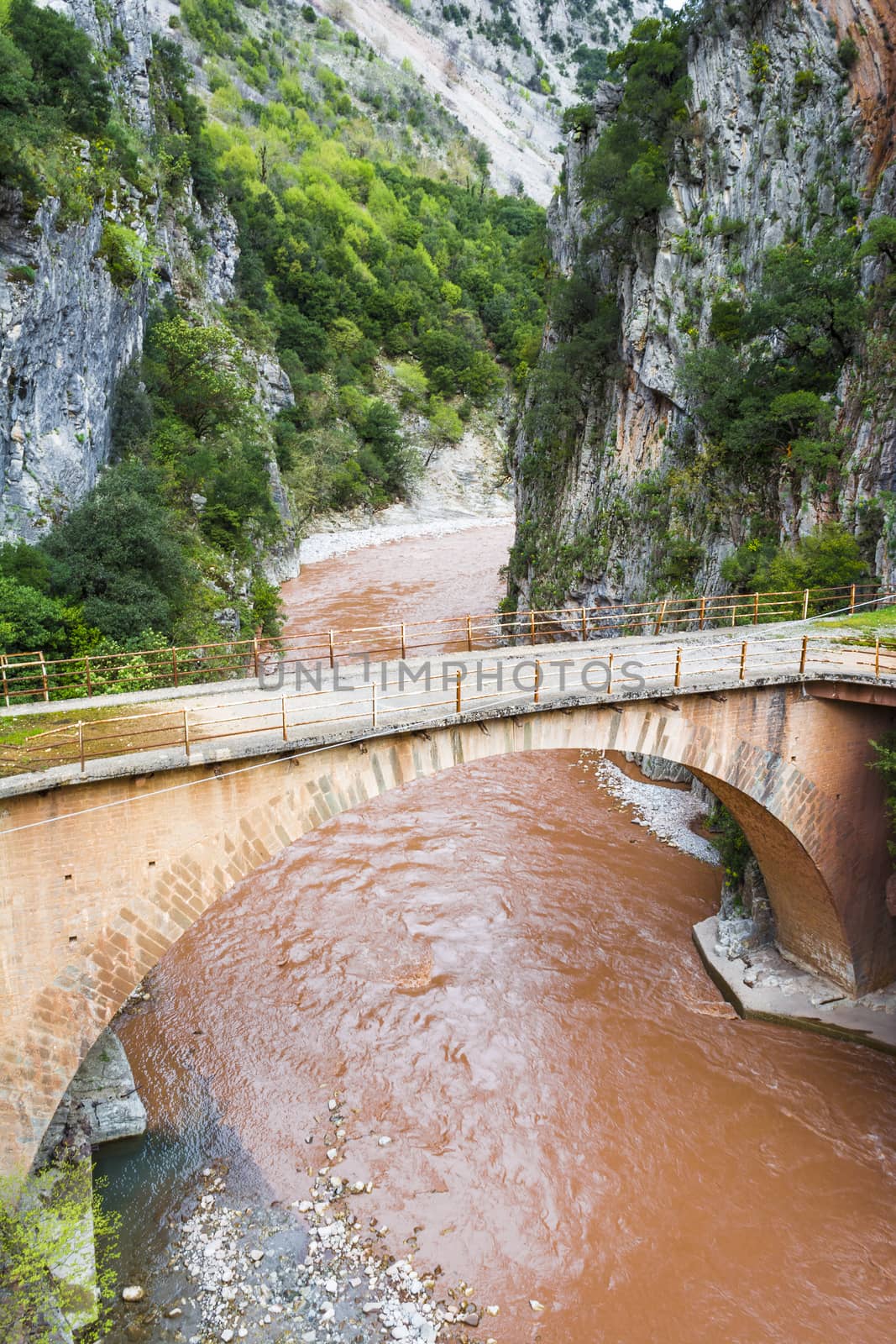 Abandoned arch bridge at Dipotama area in Evrytania leading from Karpenisi town to Proussos monastery.