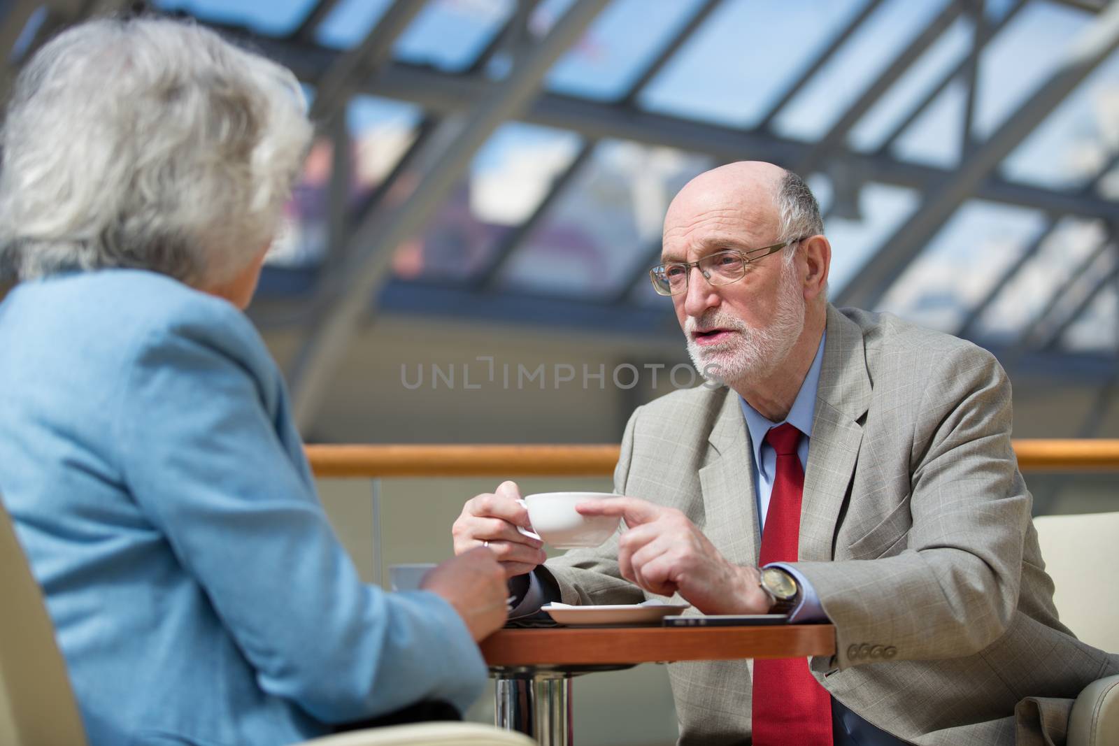 Senior couple drink coffee by ALotOfPeople